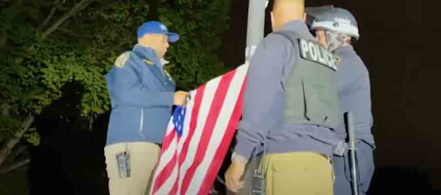 Cover Image for Video: NYPD Re-Hoists American Flag at Columbia